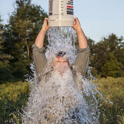 Man pouring icy water on his head