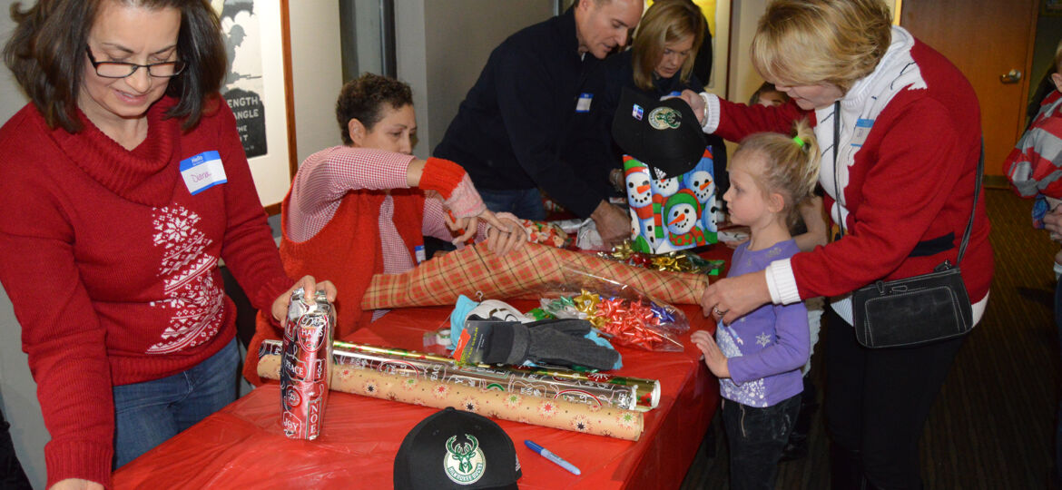 People wrapping gifts - USO Wisconsin