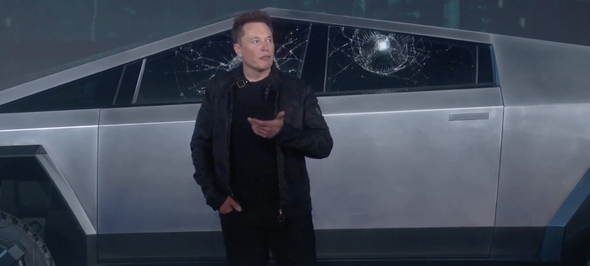 Elon Musk demonstrating Tesla vehicle's window strength and breaking the window
