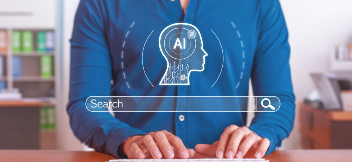Person typing on a keyboard at a desk with a digital AI head icon and search bar overlay