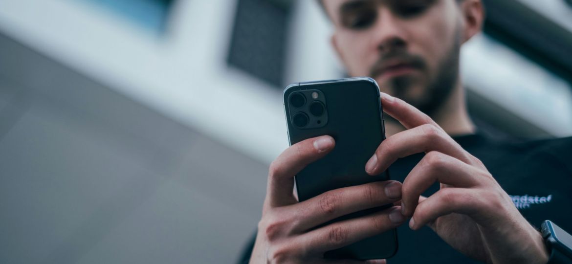 Man intently using a cellphone
