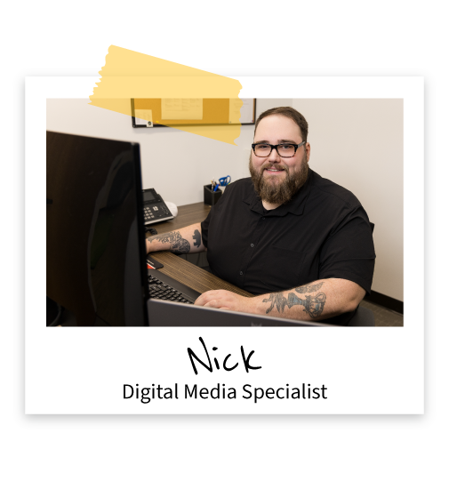 TRG-Marketing_Team_Nick Nick seated at his desk in the TRG office
