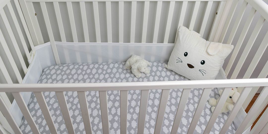 white crib in nursery while preparing for fatherhood