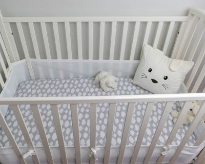 white crib in nursery while preparing for fatherhood